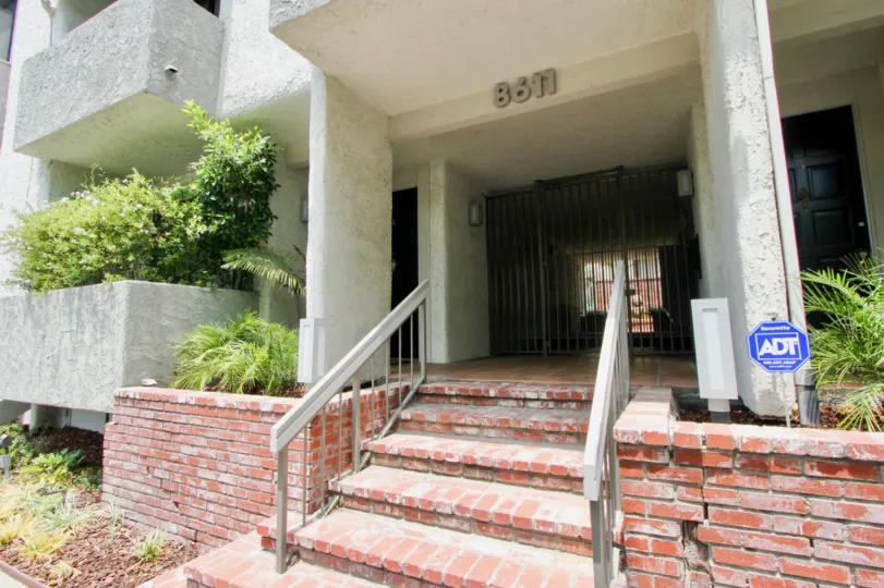 Brick steps to Sherbourne Villas entrance on a sunny day