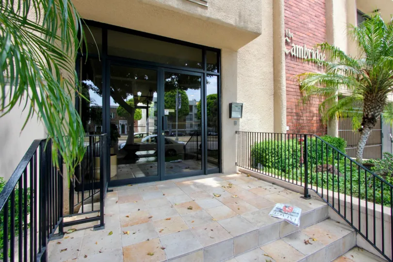 Take the beautiful marble steps through the glass entrance of the Cambridge
