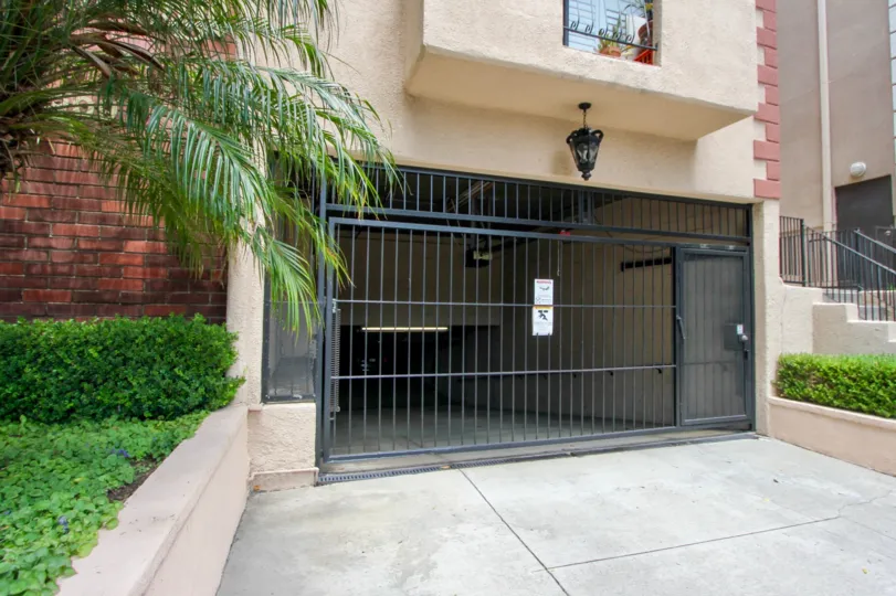 The Cambridge building parking garage entrance and gate for vehicles and pedestrians in Beverly Center, California