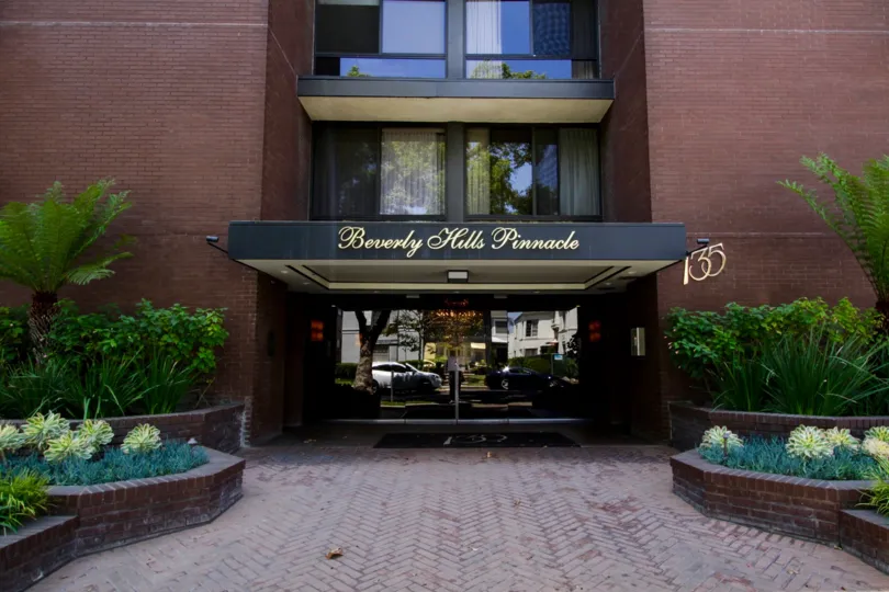 The glass door entry of the Beverly Hills Pinnacle