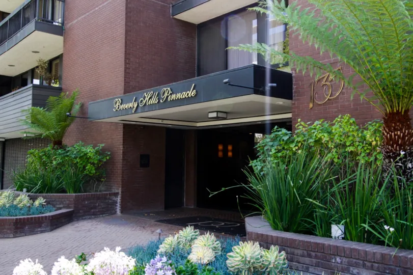 The lettering of the Beverly Hills Pinnacle above the entrance