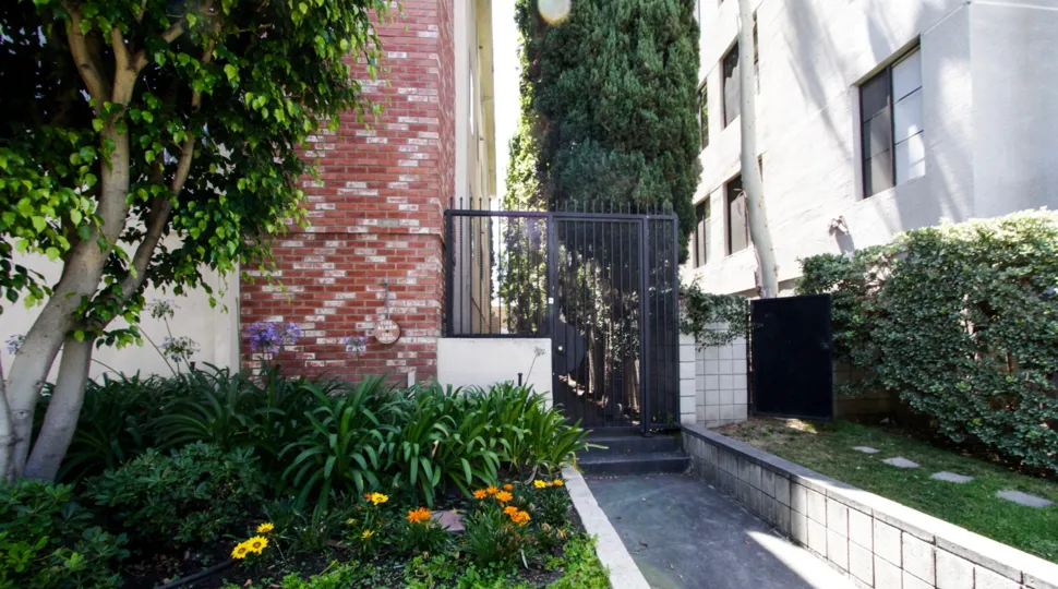 The gated side entrance of the Chateau Reeves in Beverly Hills