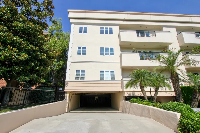 A view of an entry to an apartment building's parking garage in Palm Drive Plaza.