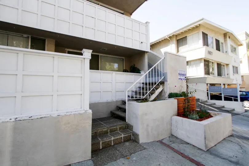 Stairs lead up the side of 11627 Chenault