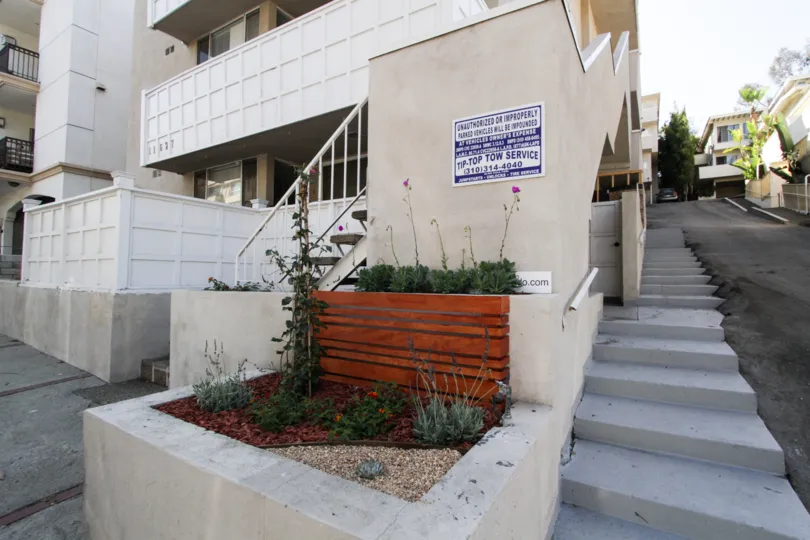 A small planter at the front of the 11627 Chenault condos
