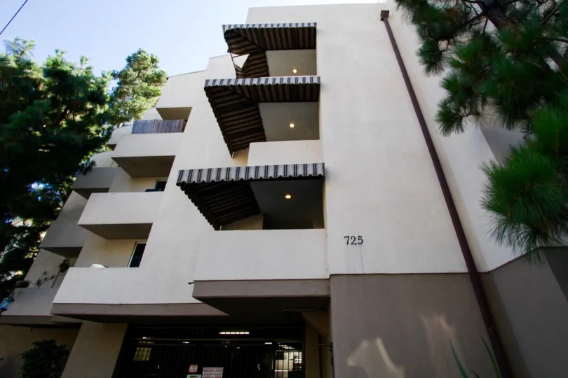 Stripped canvas covers the balconies of 725 S Barrington for extra shade