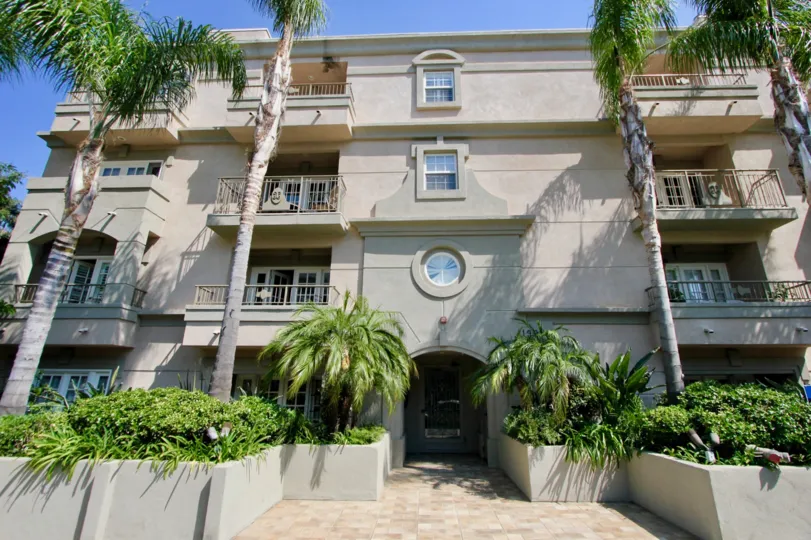 Stylish apartments at Brentwood Darlington with interesting architecture, personal porches, and palm trees