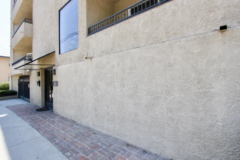 Lush landscape decorates the front of the Brentwood Estates building