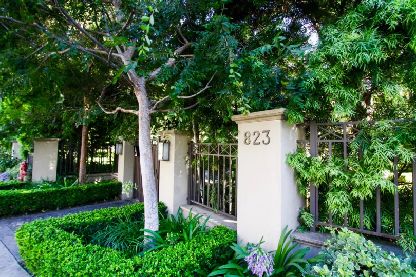 The Brentwood Garden Villas address number are mounted to a pillar