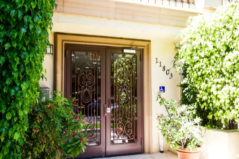 Entry to Brentwood Goshen through wrought iron doors