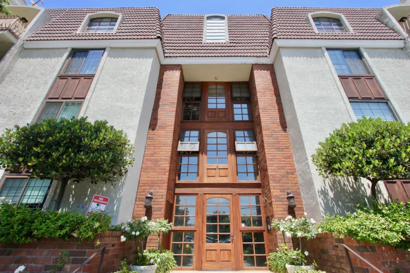 Brentwood Pines, Brentwood, California is a beautiful building with an entrance door made by glass windows