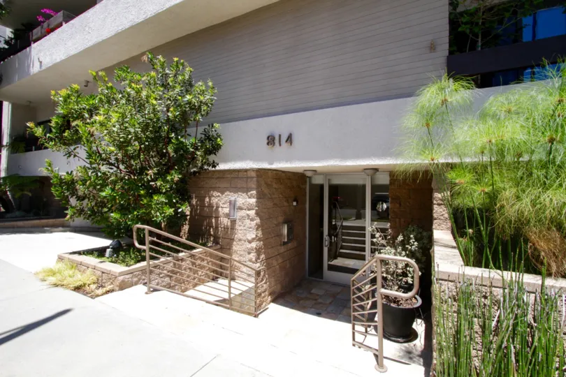 Down a set of stairs is the front entry to Brentwood Tower