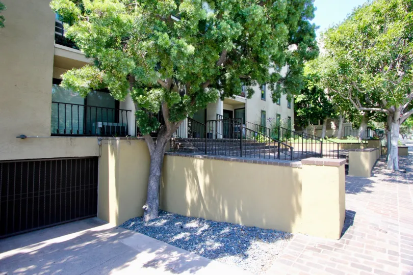 A shaded entrance to the Brentwood Townhomes on a beautiful sunny day.