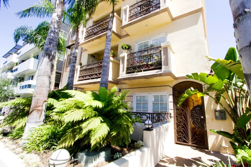 A ornate wrought iron gate leads to the entrance of Brentwood View