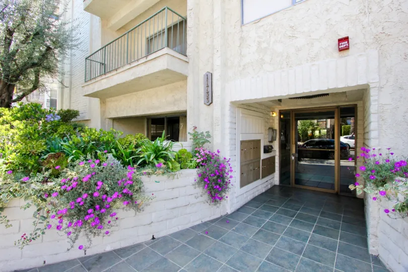 Classy entrance with super cool flowers of Chateau Brentwood Apartment, Brentwood, Calfornia