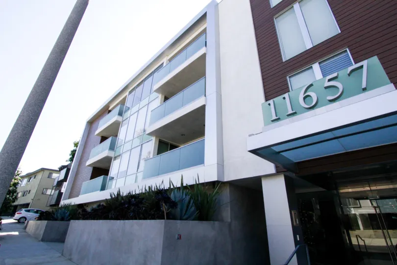 Frosted glass panel balconies on the front of the Chenault Flats building