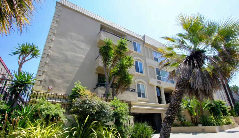 The lovely Chenault Villas of Brentwood, California surrounded by lush greenery and palms.