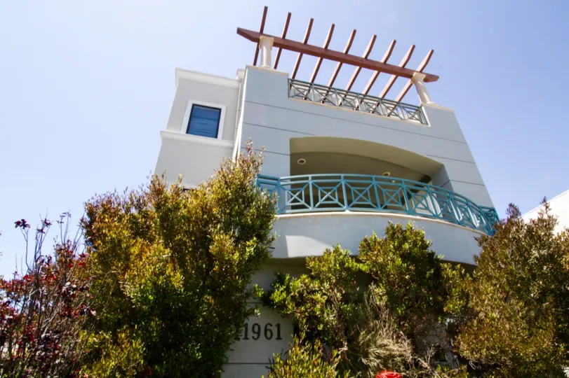 A balcony wraps around the upper level of Darlington Penthouse