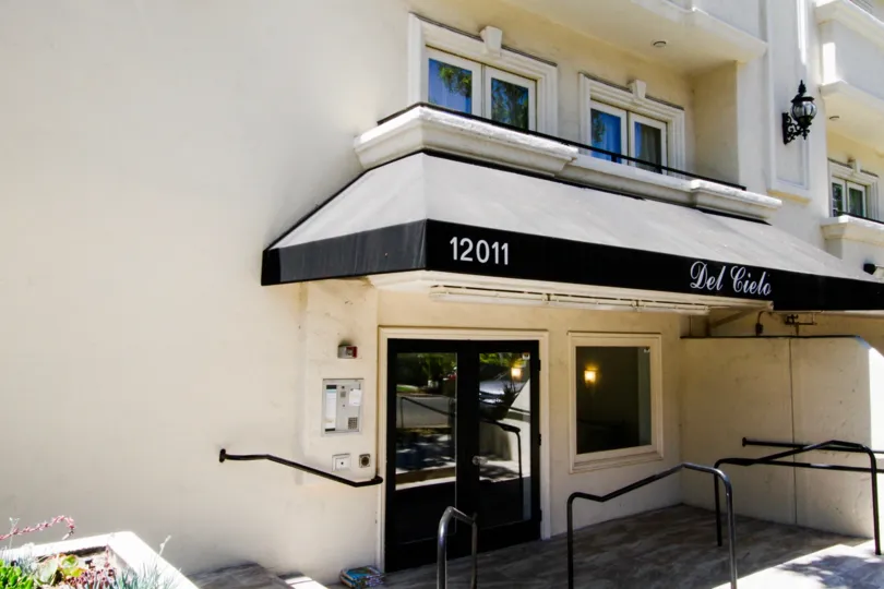 Double door entrance to the Del Cielo building