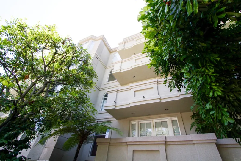 Stucco covered balconies on each level of The Excelsior condo building