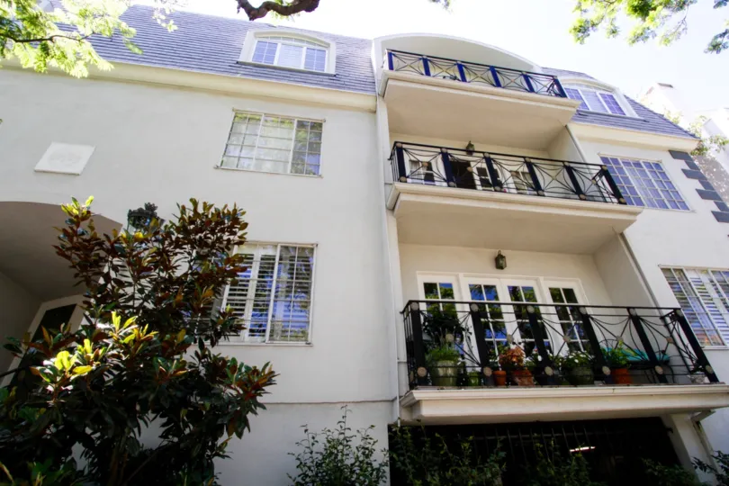 Metal balconies with gold accents at Fleur De Lis Brentwood