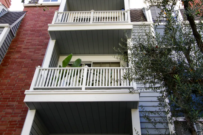 White wood railings on the Gorham Regency balconies