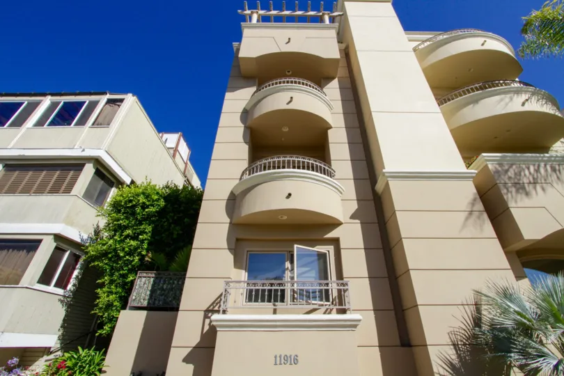 Rounded balconies extend off the front of Gorham Villas building