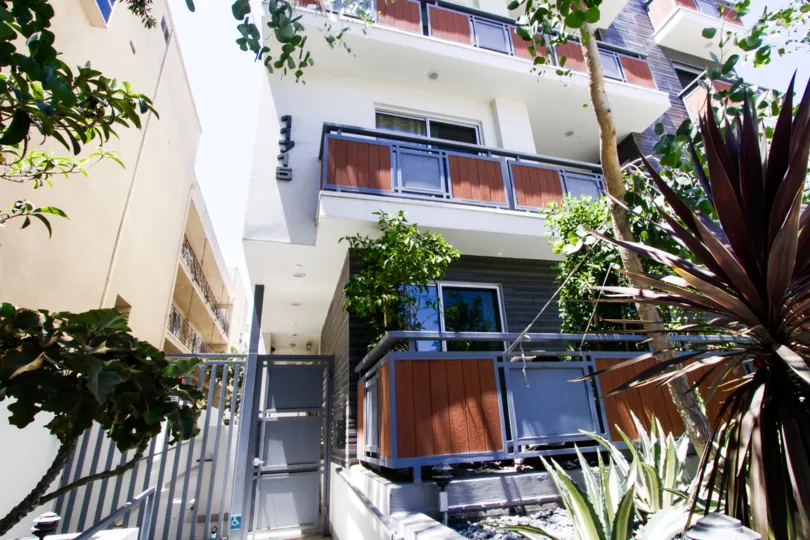 Metal and wood balconies wrap each level of Goshen Gramercy