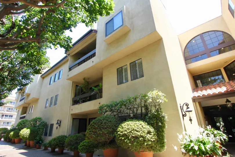 The beige Le Provencal building in Brentwood with clay roof tiles