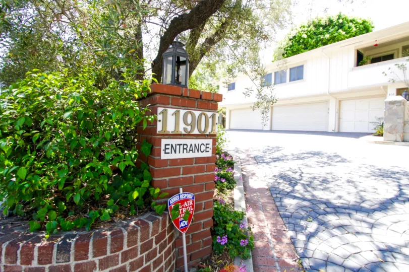 Entrance marquee to Sunset Brentwood on a brick pillar