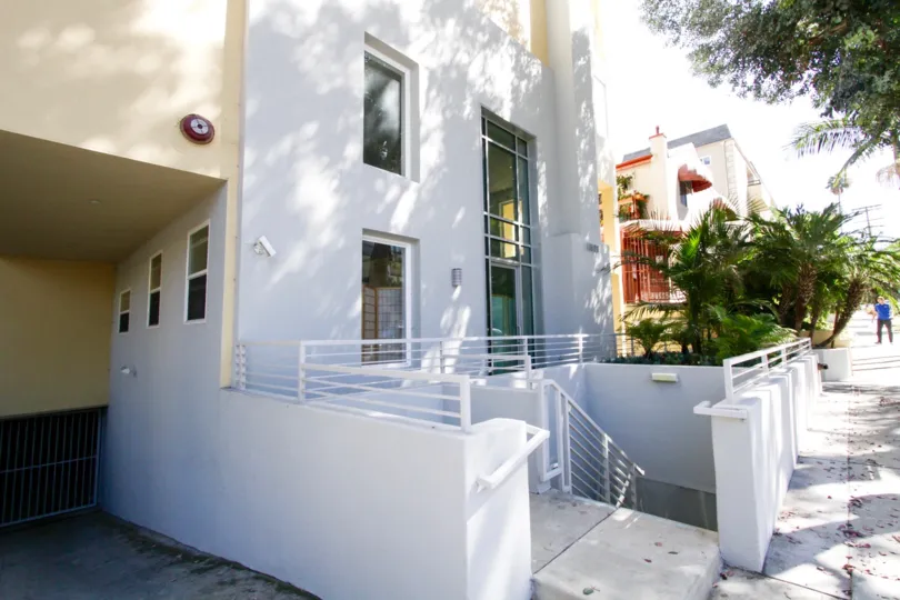 Stairs leading down to the parking area for The Chenault condos