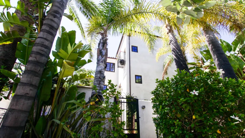 Lush landscaping covers the Villas Del Encanto entrance