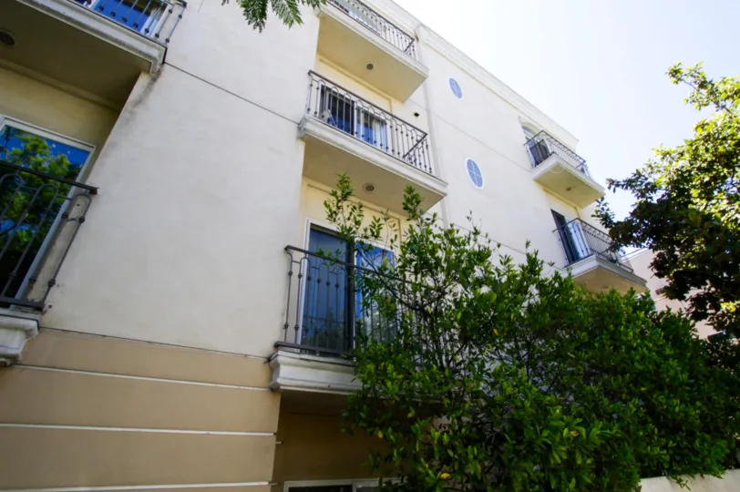 Trees cover a portion of the Westgate Place condos