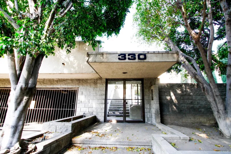 The address to Toulca Townhomes written above the entrance