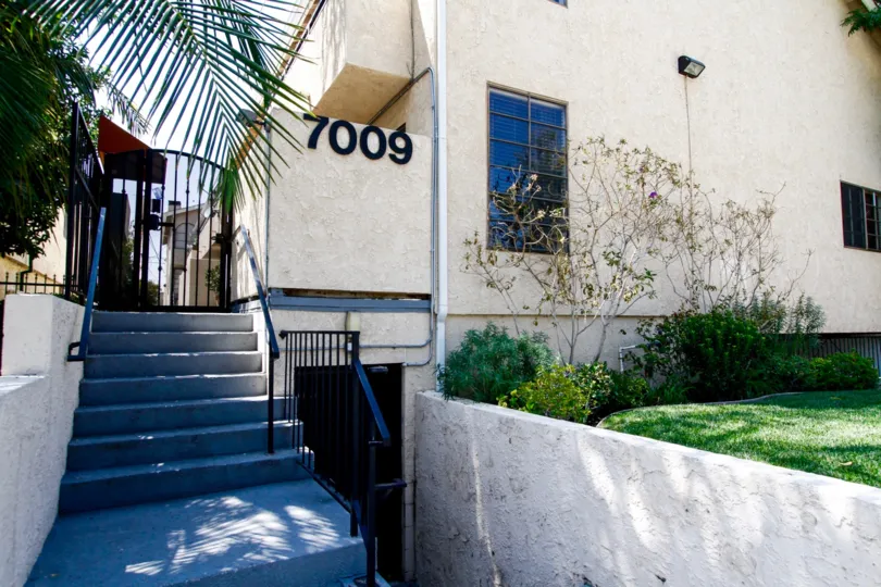 The address of 7009 Remmet Ave written on the building