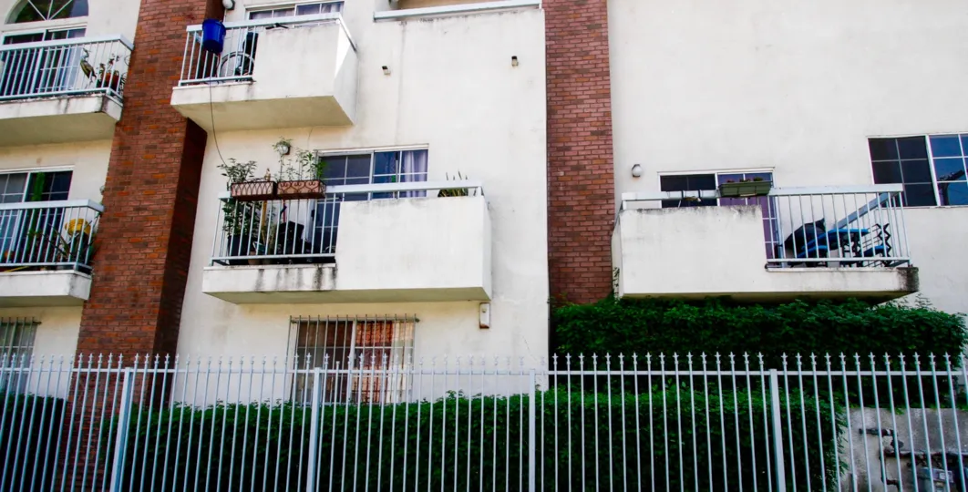 The fence that surrounds the Woodland Court property