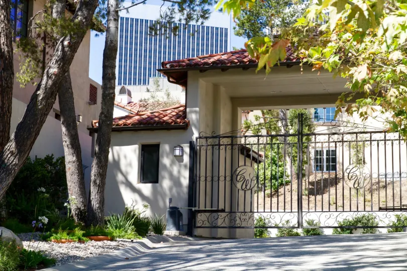The gates leading to Century Woods have monograms of the community name