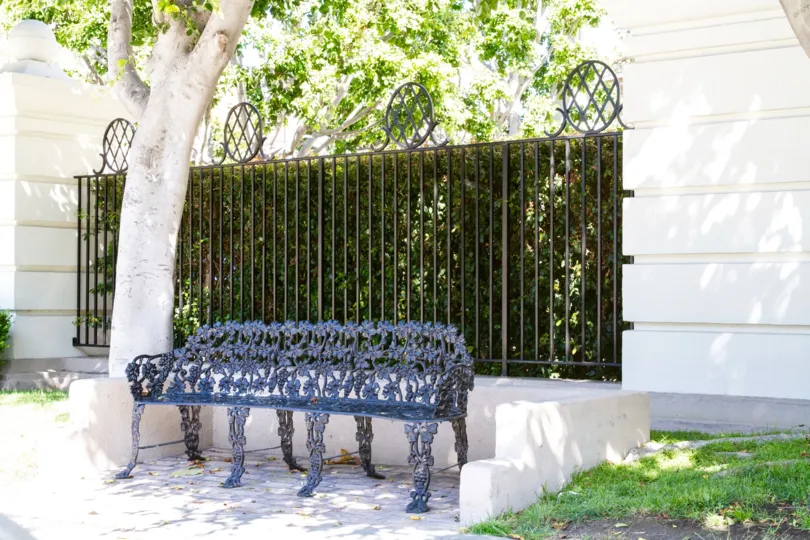 An ornate metal bench near the entrance to Le Parc