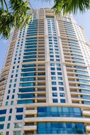 The Century is a high-rise building oval in shape with balconies on each floor