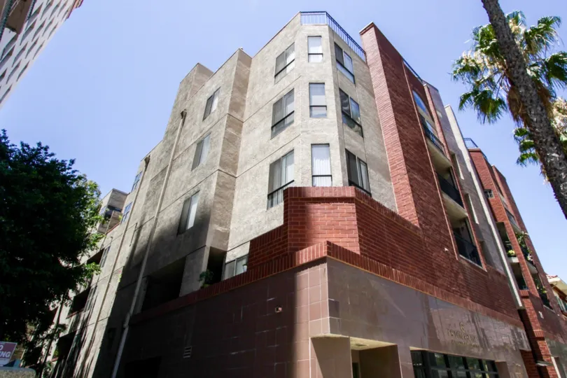 The front of 35 Linden is covered in tile, red brick and stucco