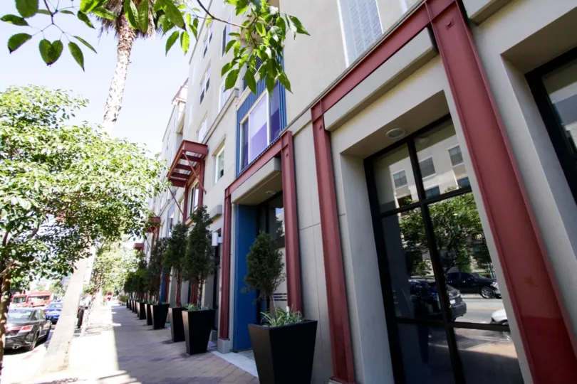 Sidewalk in front of Blu with a trees planted next to street