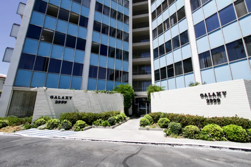 Entrance to Galaxy Tower with shrubs planted on both sides