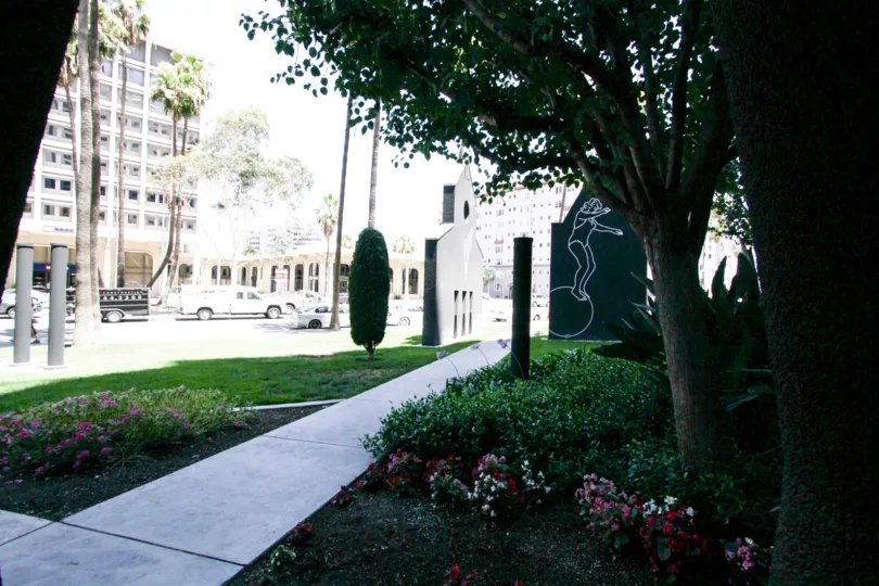 Flowers are planted throughout the planters surrounding Harbor Place Tower