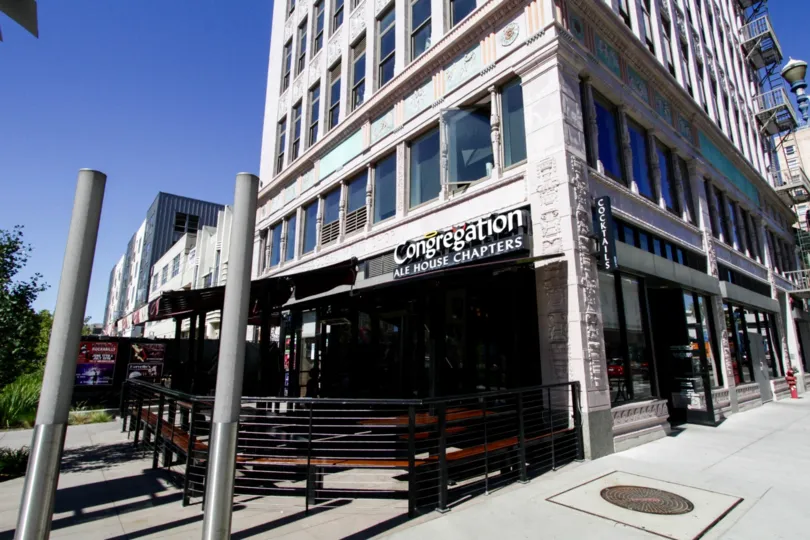 A restaurants occupies the corner of the first floor of Insurance Exchange Lofts building