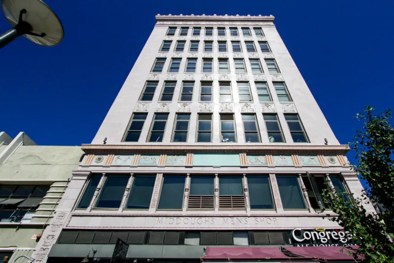The sun reflects of the windows of Insurance Exchange Lofts