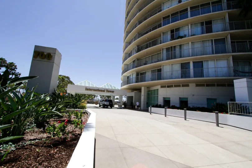 To the left of the International Tower entrance is a subterranean parking garage