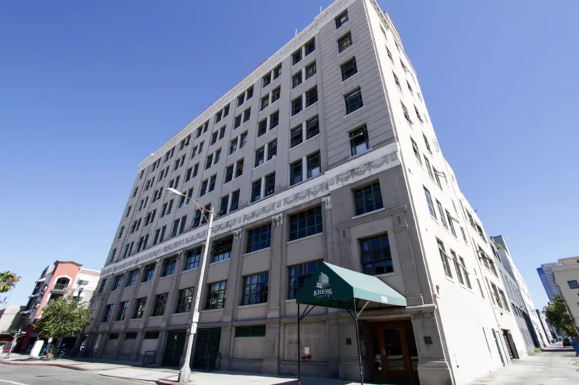 Kress Lofts is a grey condo building eight stories high
