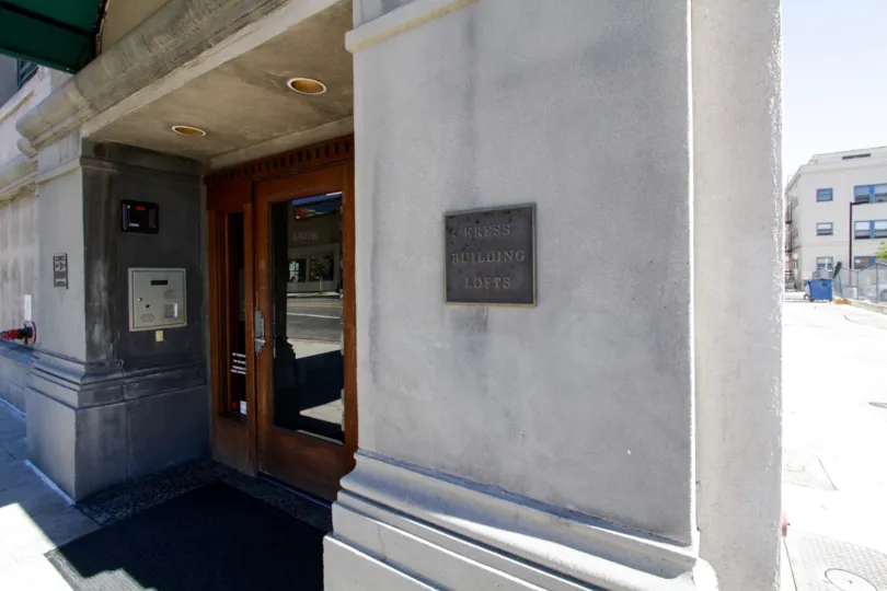 A plaque with Kress Lofts near the front entry to the building