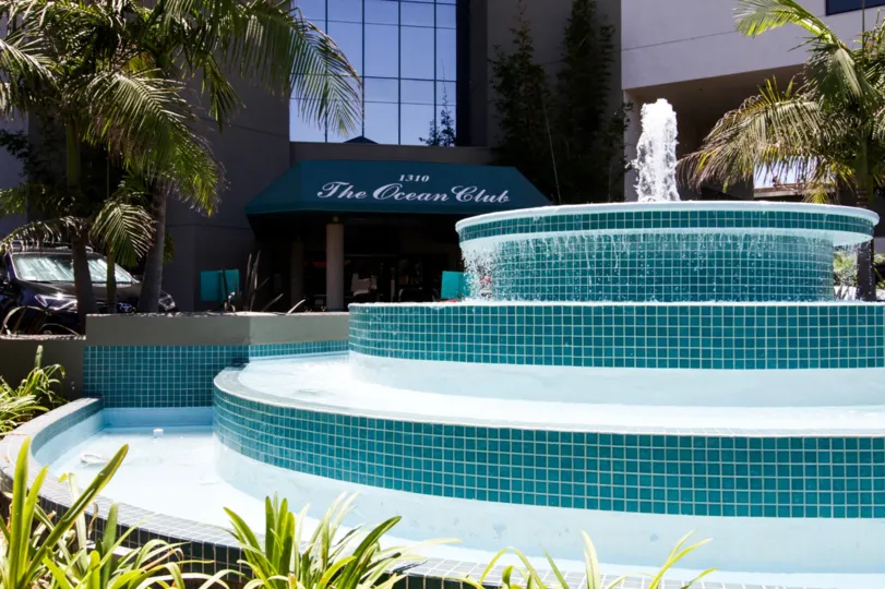 A large tiled fountain greets residents at the entry to Ocean Club