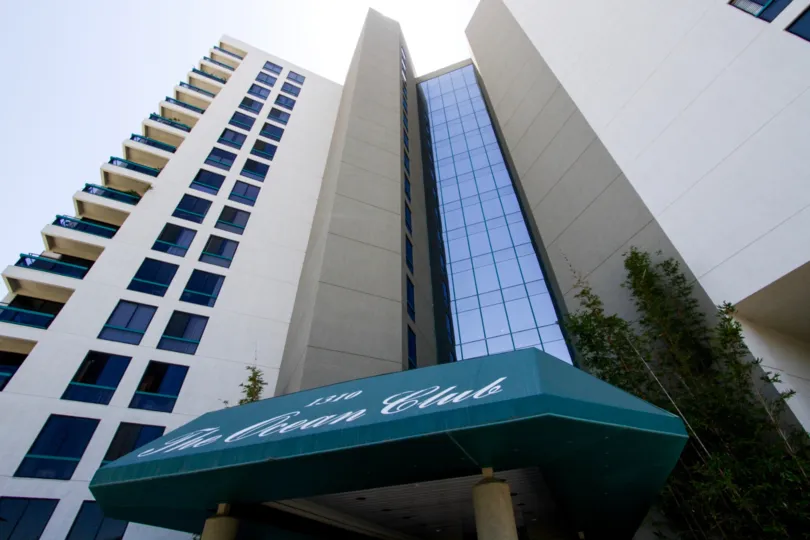 The center of Ocean Club building is all glass windows